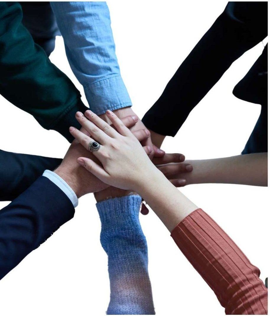 Hands of a diverse team joined together